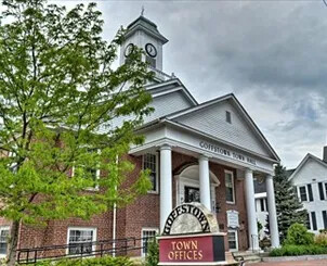 Goffstown Town Hall with clock tower and town offices sign.