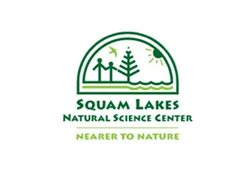 Squam Lakes Natural Science Center logo with people, tree, sun, and bird.